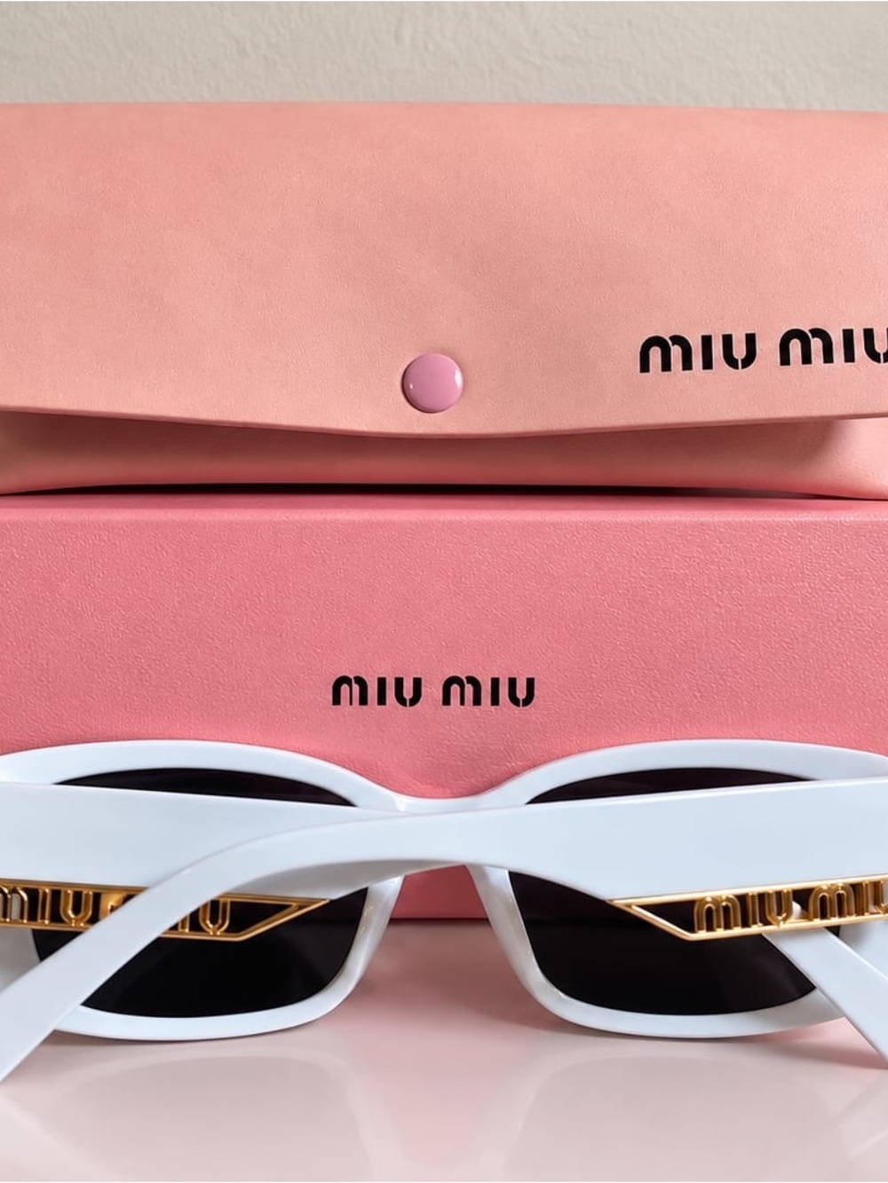 Miu Miu White Cat-Eye Sunglasses with Gold Chain Detail
